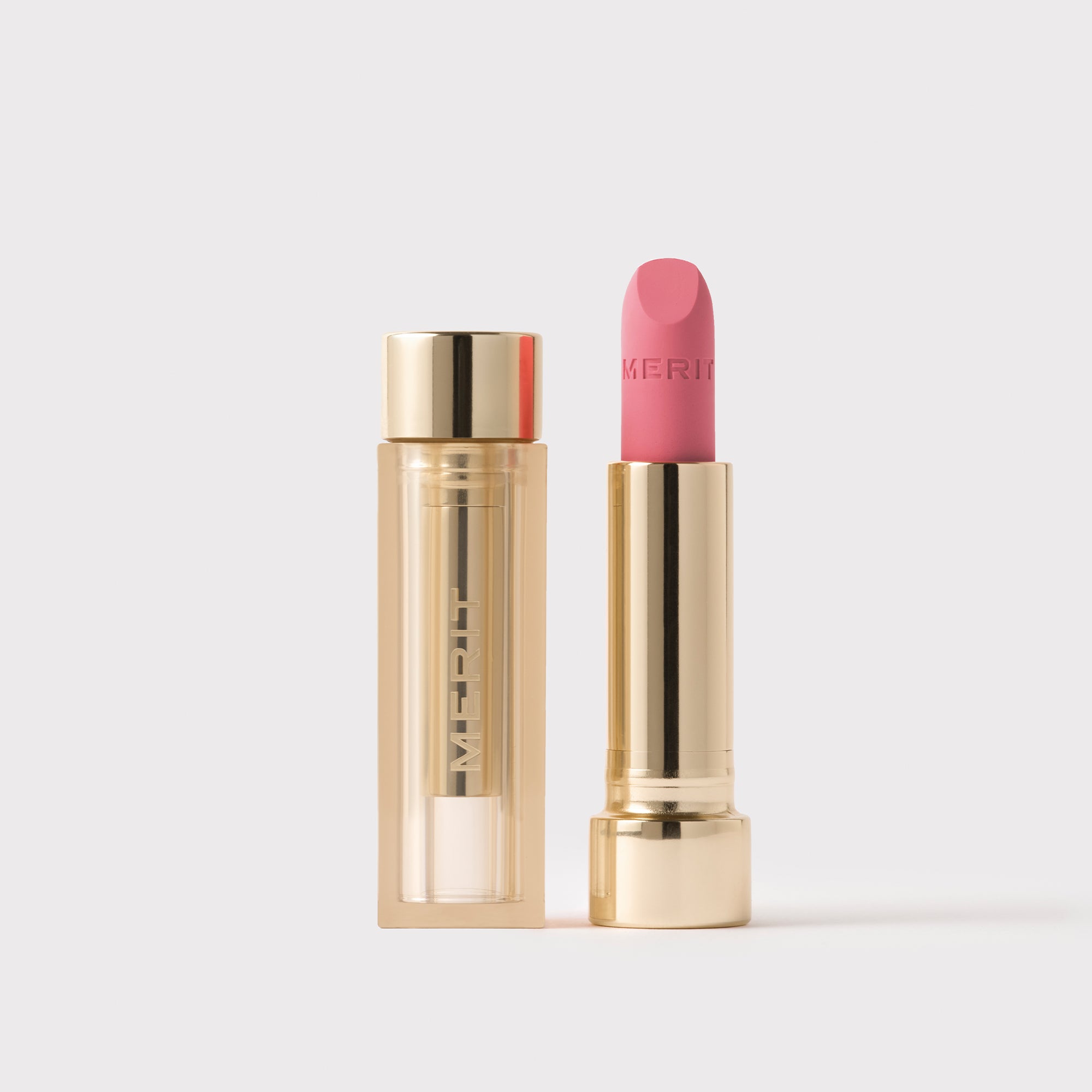 Master || Signature Lip Blush in Andie next to its case.