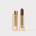 Master || Signature Lip Blush in Bespoke next to its case.