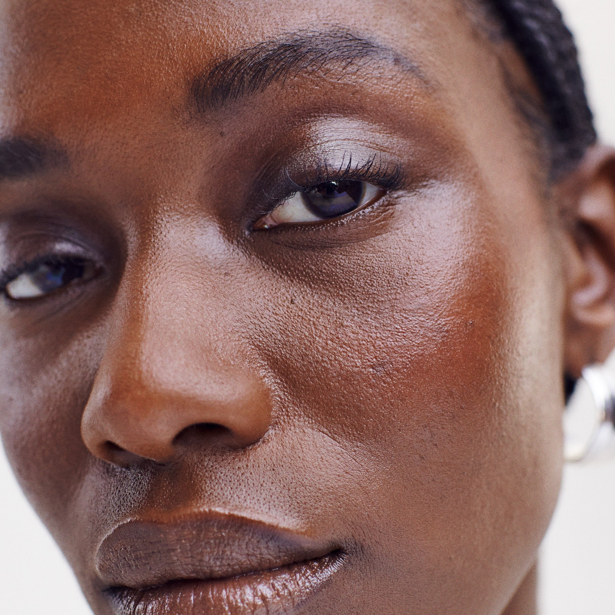 Brown-Black | face | Model is wearing Brow 1980 and Brow 1990 in Brown Black