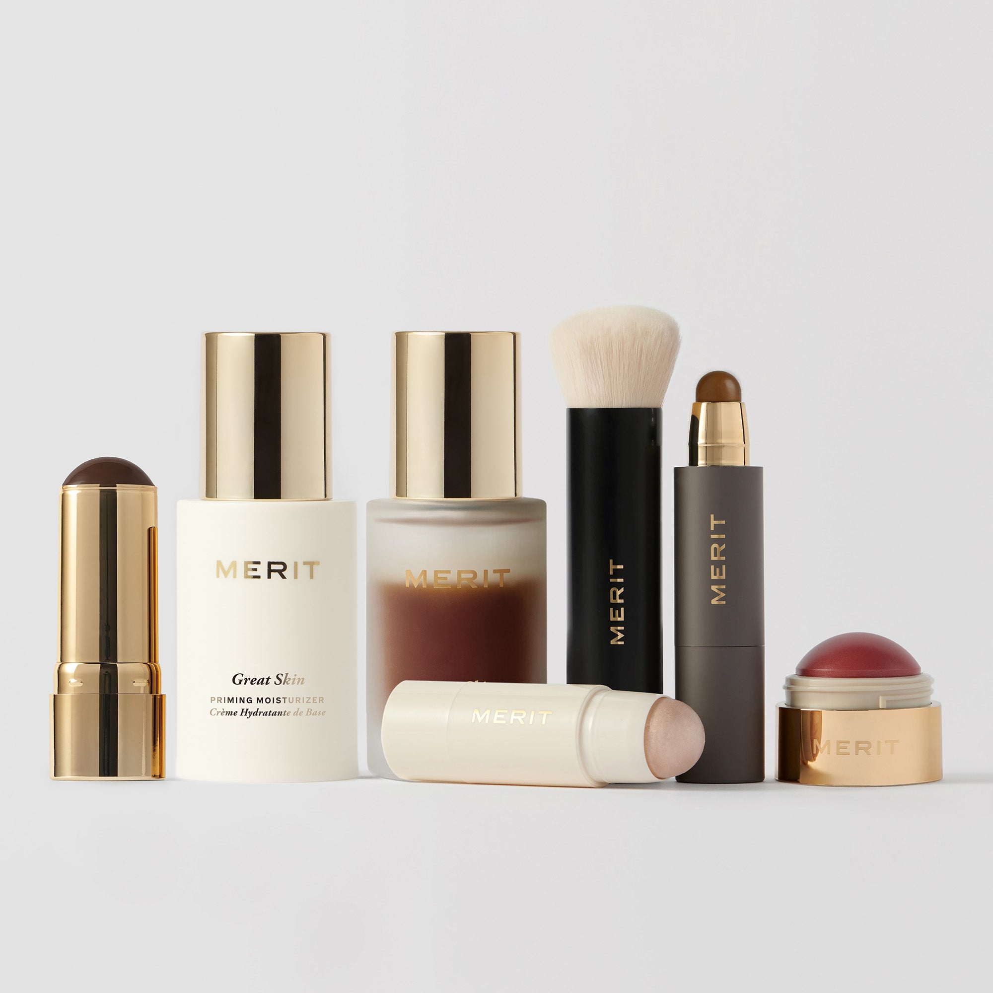 Master || Image of the complexion set which includes Bronze Balm, Great Skin Moisturizer, Great Skin Serum, Day Glow, Brush No.1,  the Minimalist, Flush balm