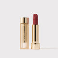 Master || Signature Lip Blush in Gamay next to its case.