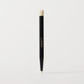 ** | listing A black cosmetic brush with a flat, dual-ended design, featuring the brand name 'MERIT' in gold lettering on the side.