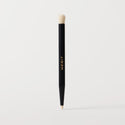 ** | listing A black cosmetic brush with a flat, dual-ended design, featuring the brand name 'MERIT' in gold lettering on the side.
