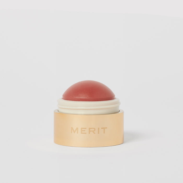 Master || A cream blush balm by Merit Beauty in color Beverly Hills and gold body