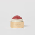 Master || A cream blush balm by Merit Beauty in color Cheeky and gold body, awarded 'Best of Beauty' by Allure in 2022.