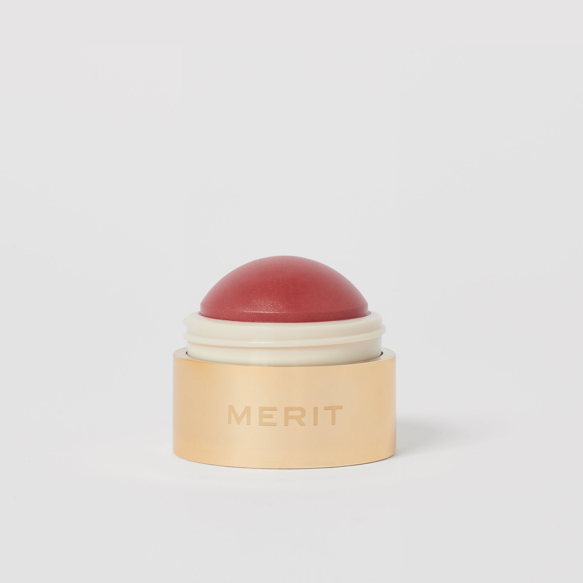 Master || A cream blush balm by Merit Beauty in color Cheeky and gold body, awarded 'Best of Beauty' by Allure in 2022.