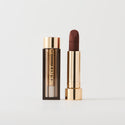 Master ||  A tube of lipstick in Equestrian with a gold and brown cap next to its open container