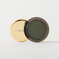 Master || A cream-to-powder eyeshadow by MERIT Beauty in Viper.