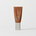 Master || A tube of MERIT brand mineral sunscreen with a sheer tint finish, providing broad spectrum 50 UVA/UVB protection, displayed against a white background. In shade 08
