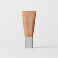 Master || A tube of MERIT brand mineral sunscreen with a sheer tint finish, providing broad spectrum 50 UVA/UVB protection, displayed against a white background. Shade 16 