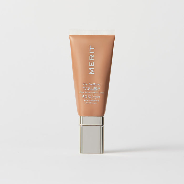 Master || A tube of MERIT brand mineral sunscreen with a sheer tint finish, providing broad spectrum 50 UVA/UVB protection, displayed against a white background. Shade 16 