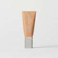 Master || A tube of MERIT brand mineral sunscreen with a sheer tint finish, providing broad spectrum 50 UVA/UVB protection, displayed against a white background. Shade 18