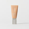 Master || A tube of MERIT brand mineral sunscreen with a sheer tint finish, providing broad spectrum 50 UVA/UVB protection, displayed against a white background. Shade 20