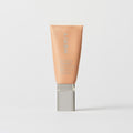 Master || A tube of MERIT brand mineral sunscreen with a sheer tint finish, providing broad spectrum 50 UVA/UVB protection, displayed against a white background. Shade 22