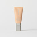 Master || A tube of MERIT brand mineral sunscreen with a sheer tint finish, providing broad spectrum 50 UVA/UVB protection, displayed against a white background. Shade 28