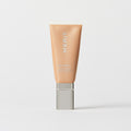 Master || A tube of MERIT brand mineral sunscreen with a sheer tint finish, providing broad spectrum 45 UVA/UVB protection, displayed against a white background. Shade 20
