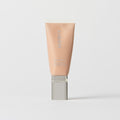 Master || A tube of MERIT brand mineral sunscreen with a sheer tint finish, providing broad spectrum 45 UVA/UVB protection, displayed against a white background. Shade 4