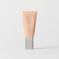 Master || A tube of MERIT brand mineral sunscreen with a sheer tint finish, providing broad spectrum 45 UVA/UVB protection, displayed against a white background. Shade 26