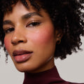 Après | face::deep | Model is wearing Flush Balm in shade Après.