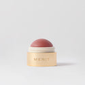 Master || A cream blush balm by Merit Beauty in color archival and gold body