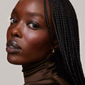 Fox | face::rich | Model is wearing Flush Balm in shade Fox.