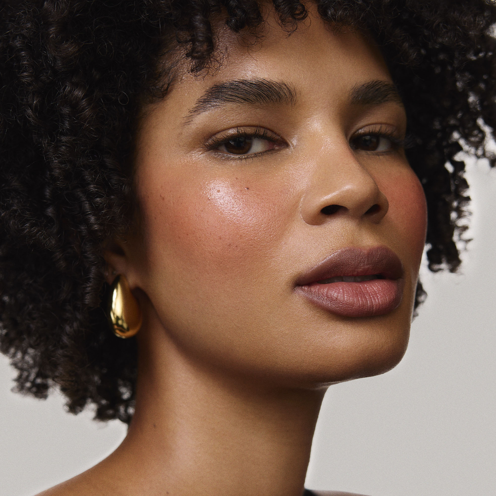 Fox | face::deep | Model is wearing Flush Balm in shade Fox