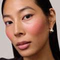 Master || Model is wearing Flush Balm in shade Le Bonbon.