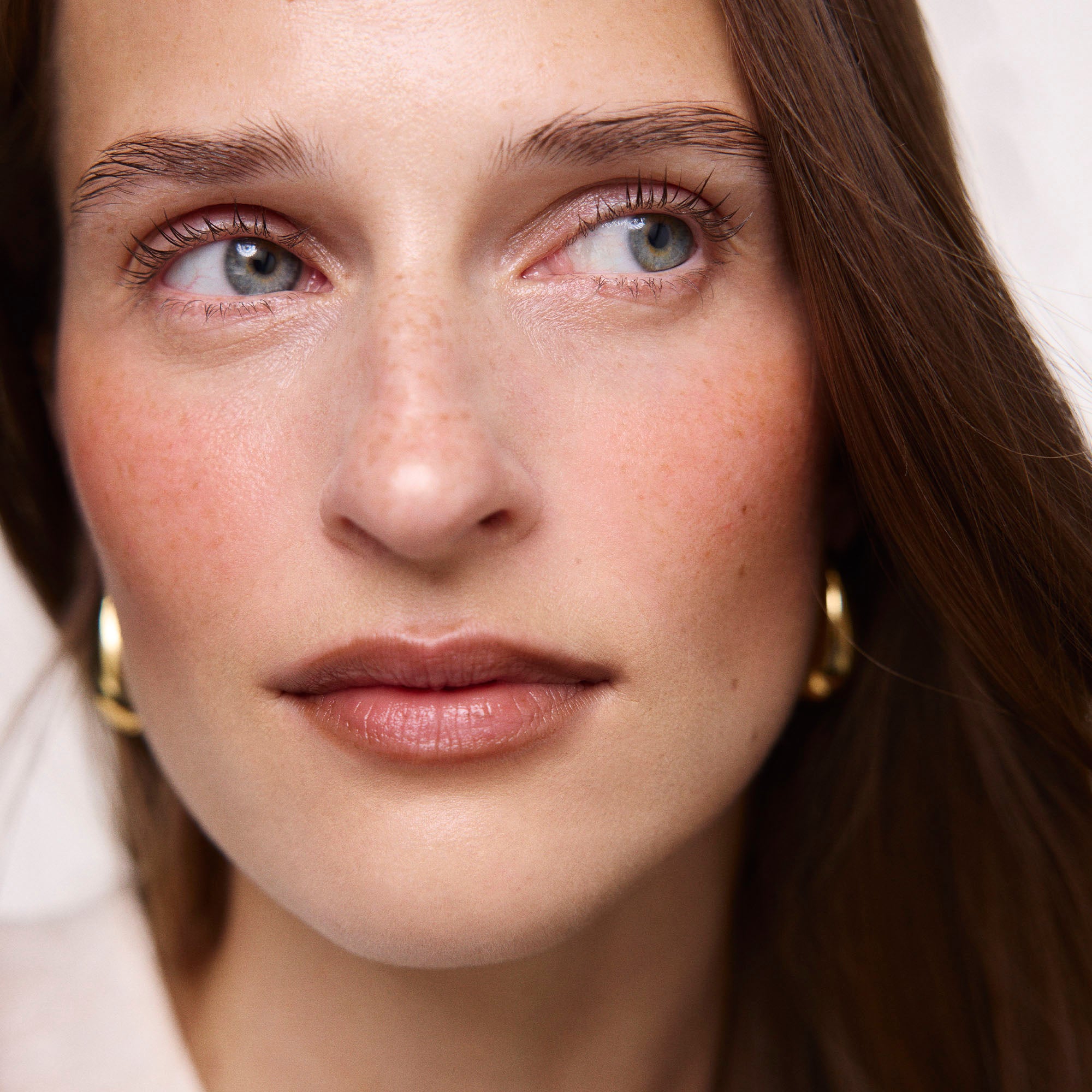 Persimmon | face::fair  |  Model is wearing Flush Balm in shade Persimmon