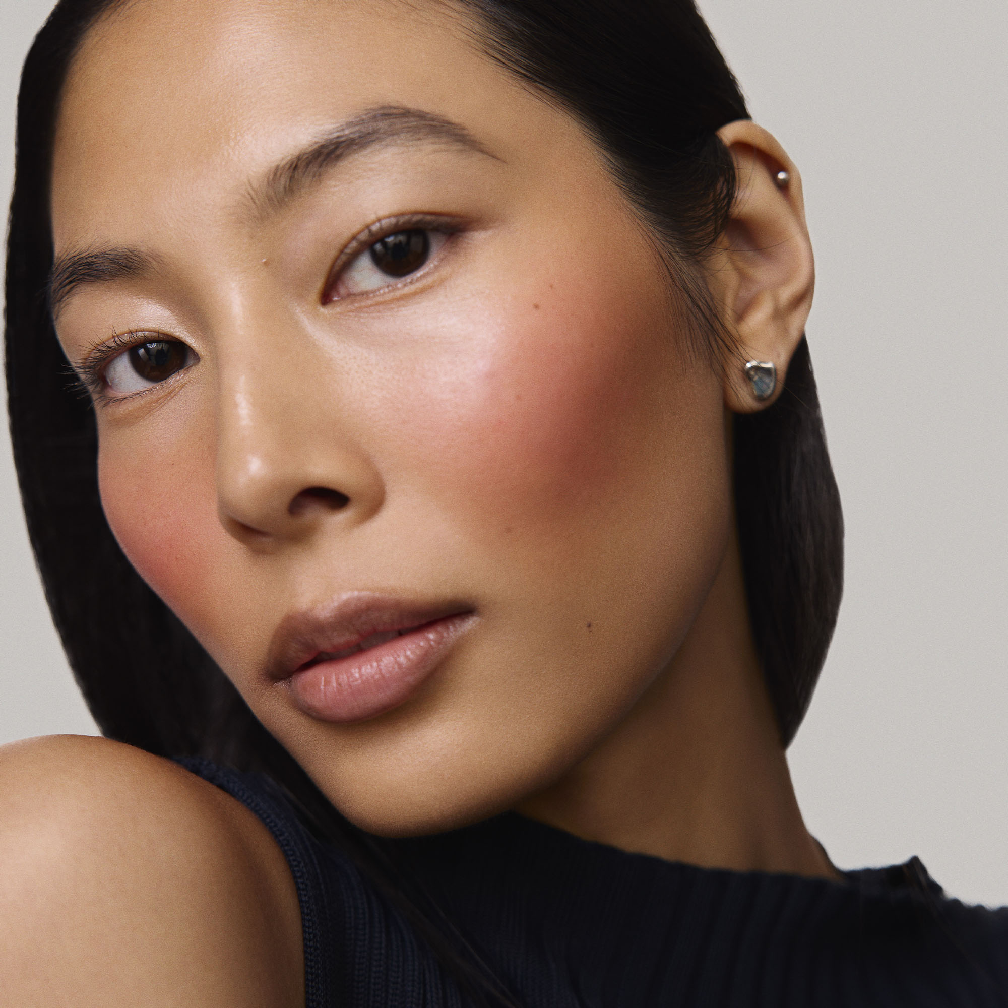 Rouge | face::medium | Model is wearing Flush Balm in shade Rouge