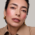 Postmodern | face::light | Model is wearing Flush Balm in shade Rouge.