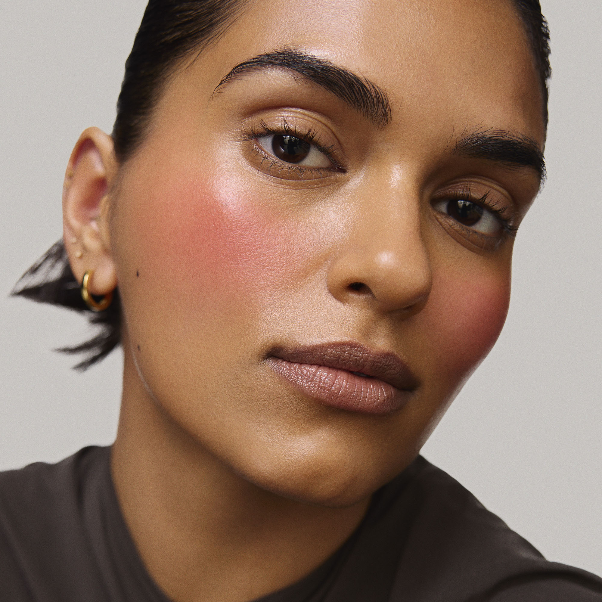 Rouge | face::medium | Model is wearing Flush Balm in shade Rouge