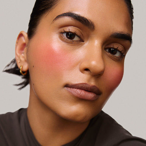 Rouge | face::medium | Model is wearing Flush Balm in shade Rouge
