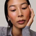 Master || Model is wearing Flush Balm in shade Terracotta.