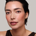 Master || Model is wearing Flush Balm in shade Terracotta.