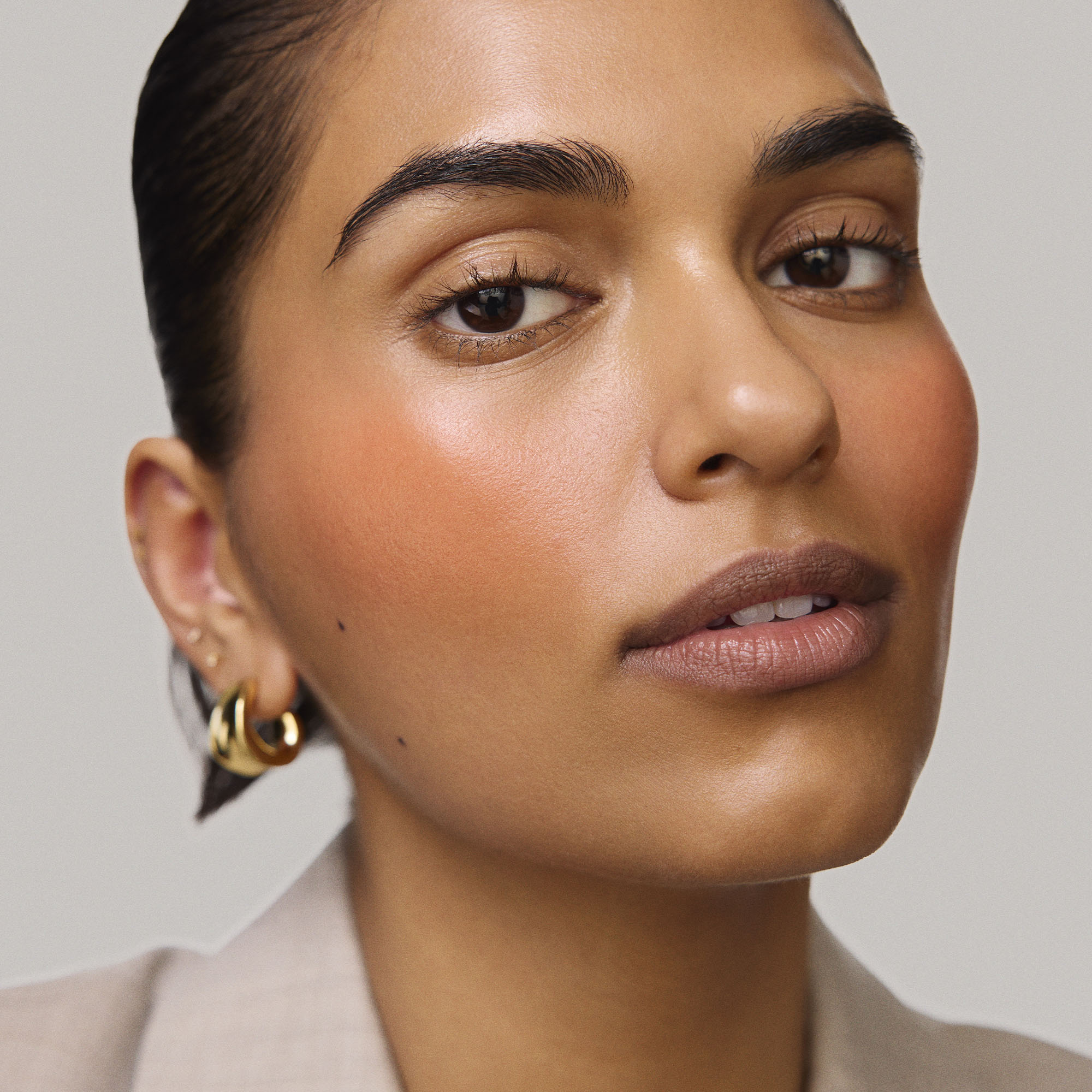 Master || Model is wearing Flush Balm in shade Terracotta