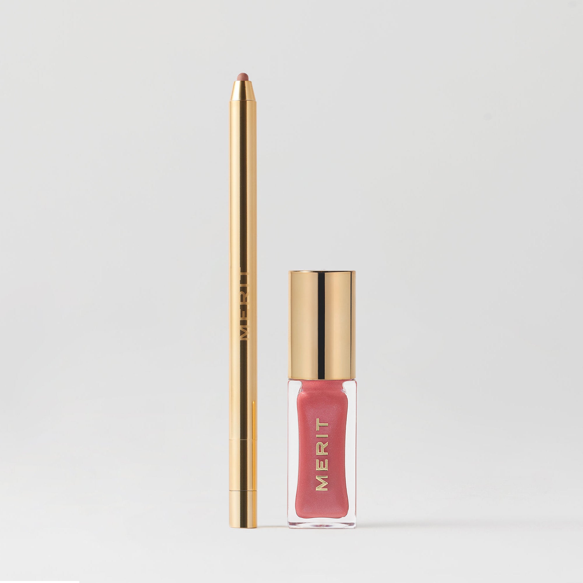 A product image featuring a gold-colored lip liner on the left and a pink shade slick on the right, both labeled with 'MERIT'.