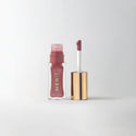 Twin Set|| A bottle of Merit lip oil in  shade Twin Set displayed next to its applicator. 
