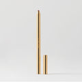 Master || A gold-colored lip liner pencil with its cap removed, displayed against a white background in shade Bespoke