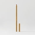 Master || A gold-colored lip liner pencil with its cap removed, displayed against a white background in shade Coupé