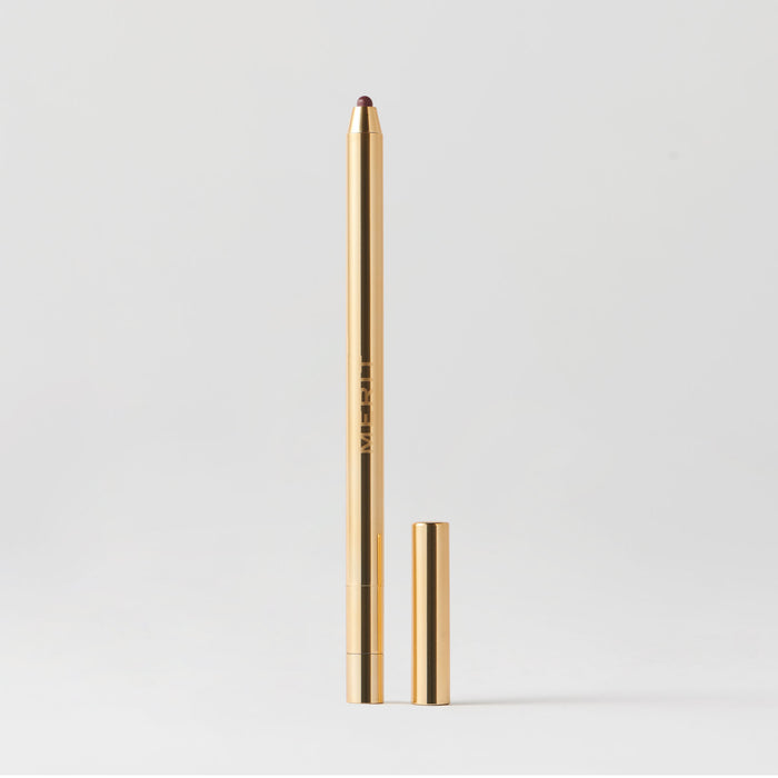 Master || A gold-colored lip liner pencil with its cap removed, displayed against a white background in shade  Mayfair 