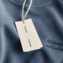 Master || Close up of tag from The Anniversary Sweatshirt.