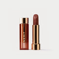  Master || A tube of lipstick is shade L'Avenue with a gold and brown cap next to its open container