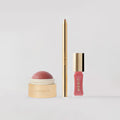 Trio makeup MERIT che include Flush Balm, Signature Lip Liner e Shade Slick 