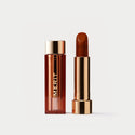 Tiger | |  A tube of lipstick in shade Tiger with a gold and brown cap next to its open container
