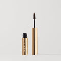 Master || Brow pomade with gold packaging on a white background.