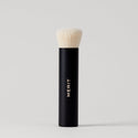 Master || A black makeup brush with a white bristle head, standing upright