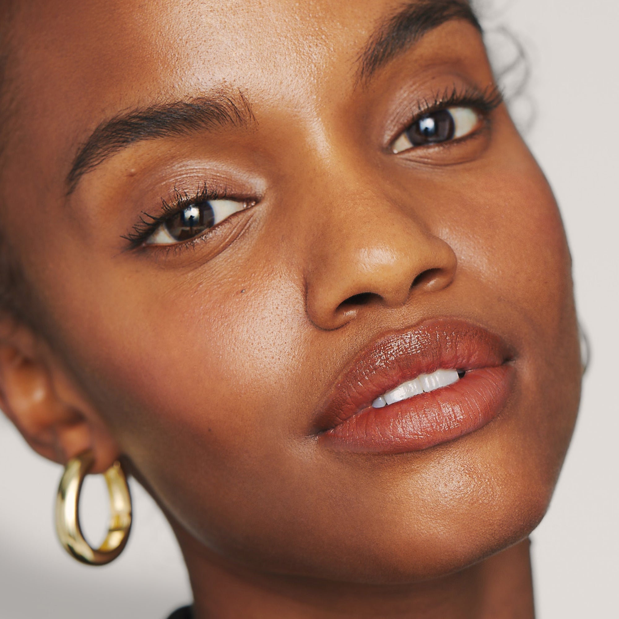 Citrine | face | Model is wearing Day Glow in Citrine